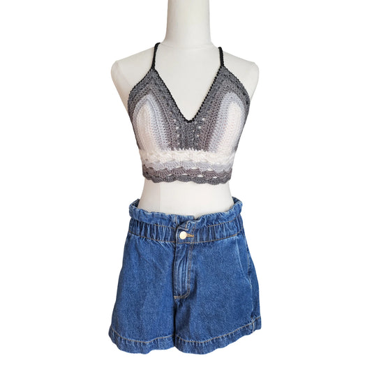 Mannequin wearing a gray crochet top and blue denim shorts on a white background
