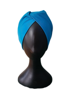 Front view of knotted stretch headband for girls on mannequin