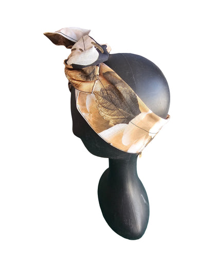 Decorative wall light fixture with a turtle design on a white background