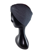 Dark gray beanie on a black mannequin head against a white background