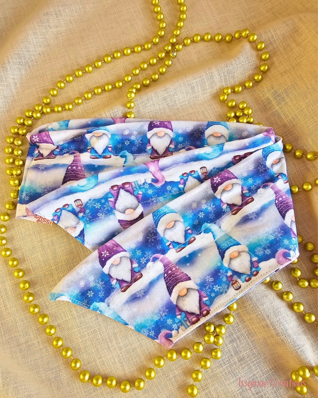 Gnome for the Holidays Christmas wire head wrap laid flat, showing pointed ends and a blue and purple gnome and snowflake print.