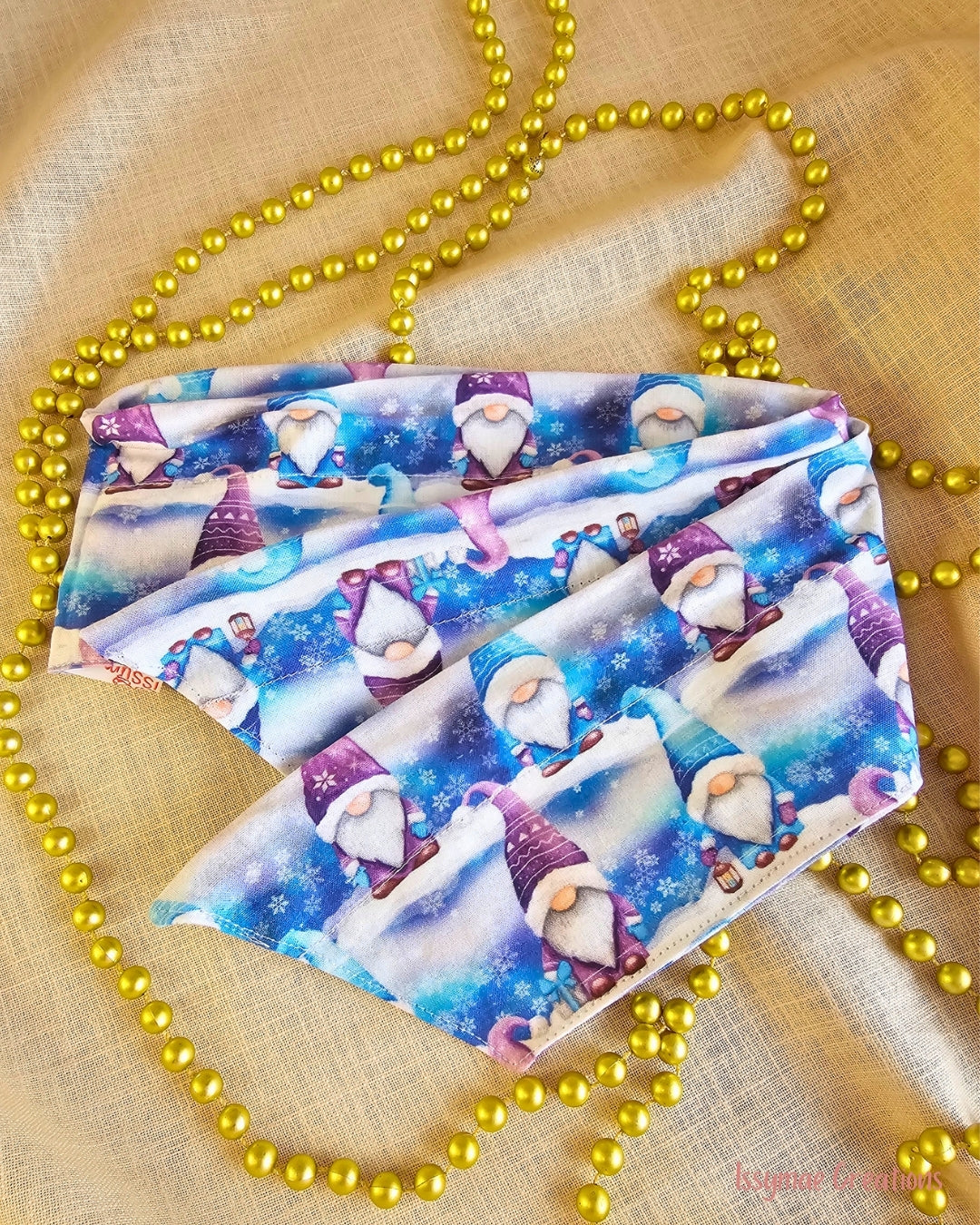 Gnome for the Holidays Christmas wire head wrap laid flat, showing pointed ends and a blue and purple gnome and snowflake print.