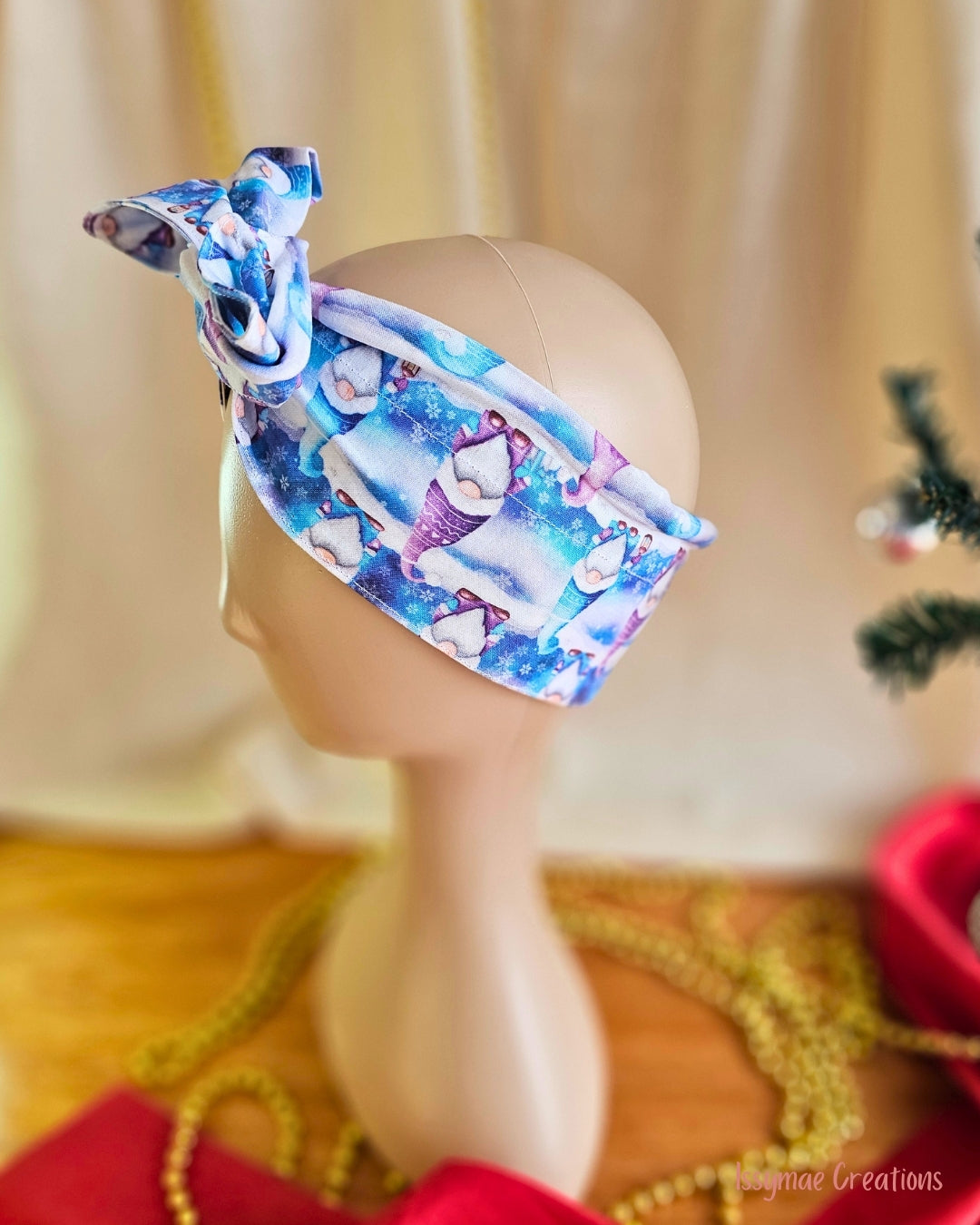  Side view of Gnome for the Holidays wire head wrap, showing the wide band with blue and purple Christmas gnomes.