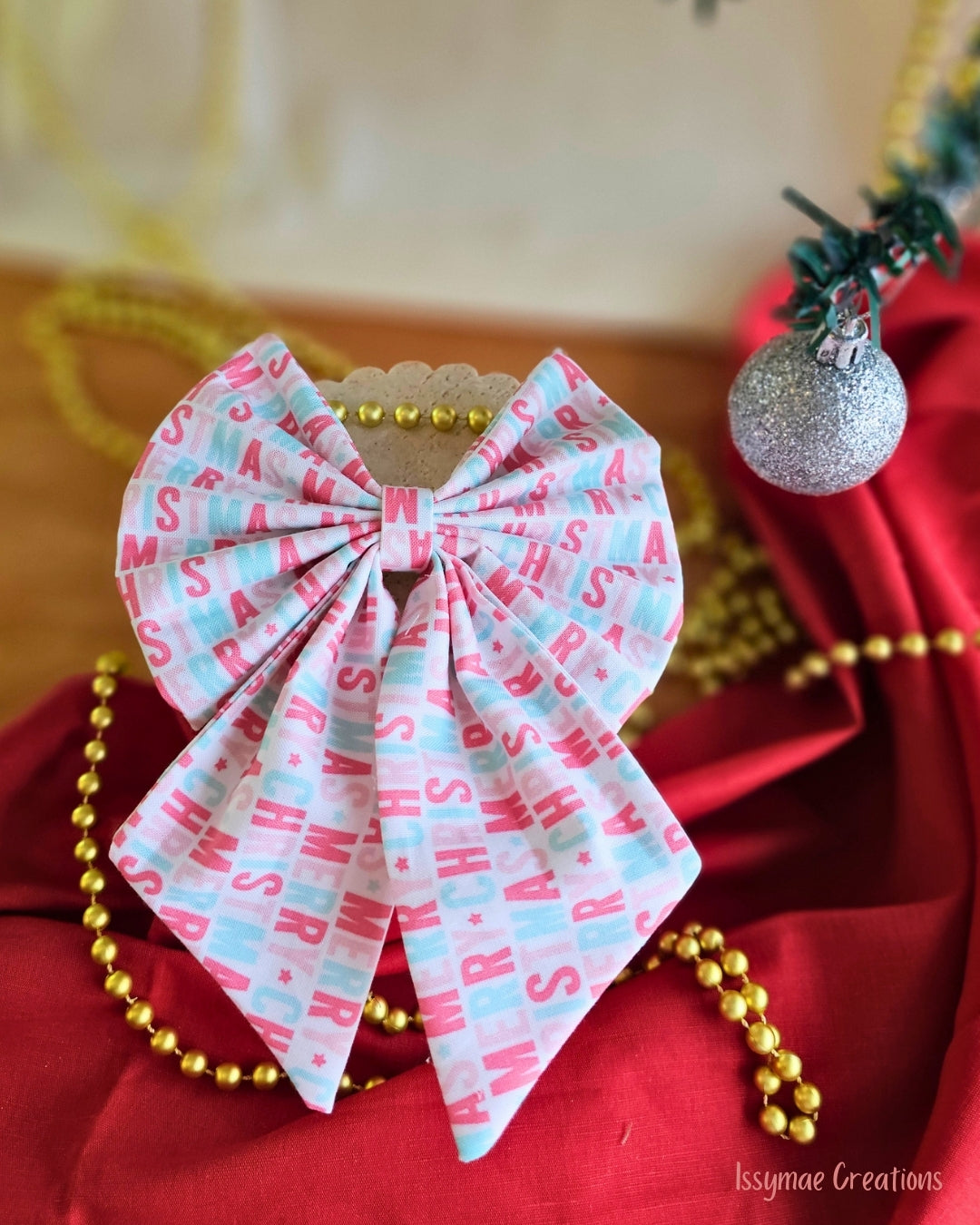 Pattern Christmas Hair Bow on a red and cream background
