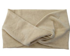 Beige towel folded neatly on a white background