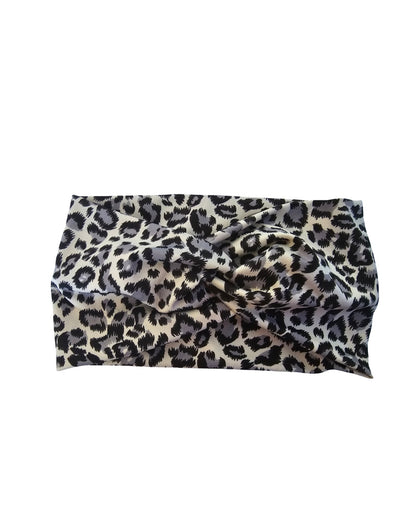Leopard print headband on a white background