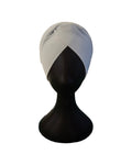 White turban on a black mannequin head against a white background