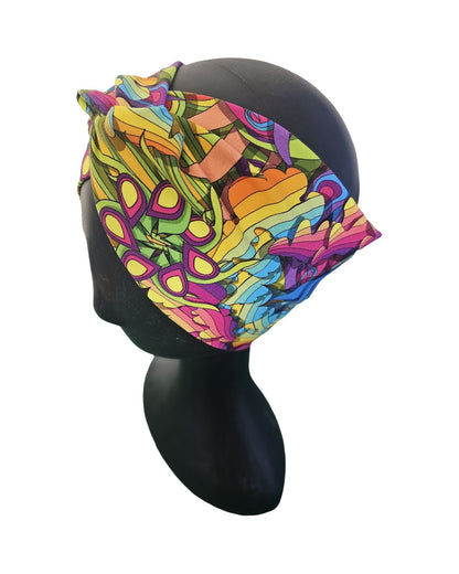 Colorful headscarf with abstract pattern on a mannequin head against a white background