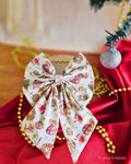 Christmas pattern hair bow on a red and gold background