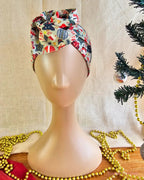 Snow Much Fun Christmas wire head wrap styled with a twisted top knot on a mannequin, front view.